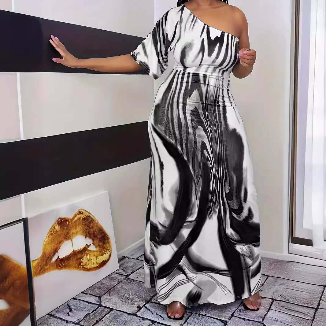 PRINTED ONE-SLEEVED DRESS WITH SLOPING SHOULDERS