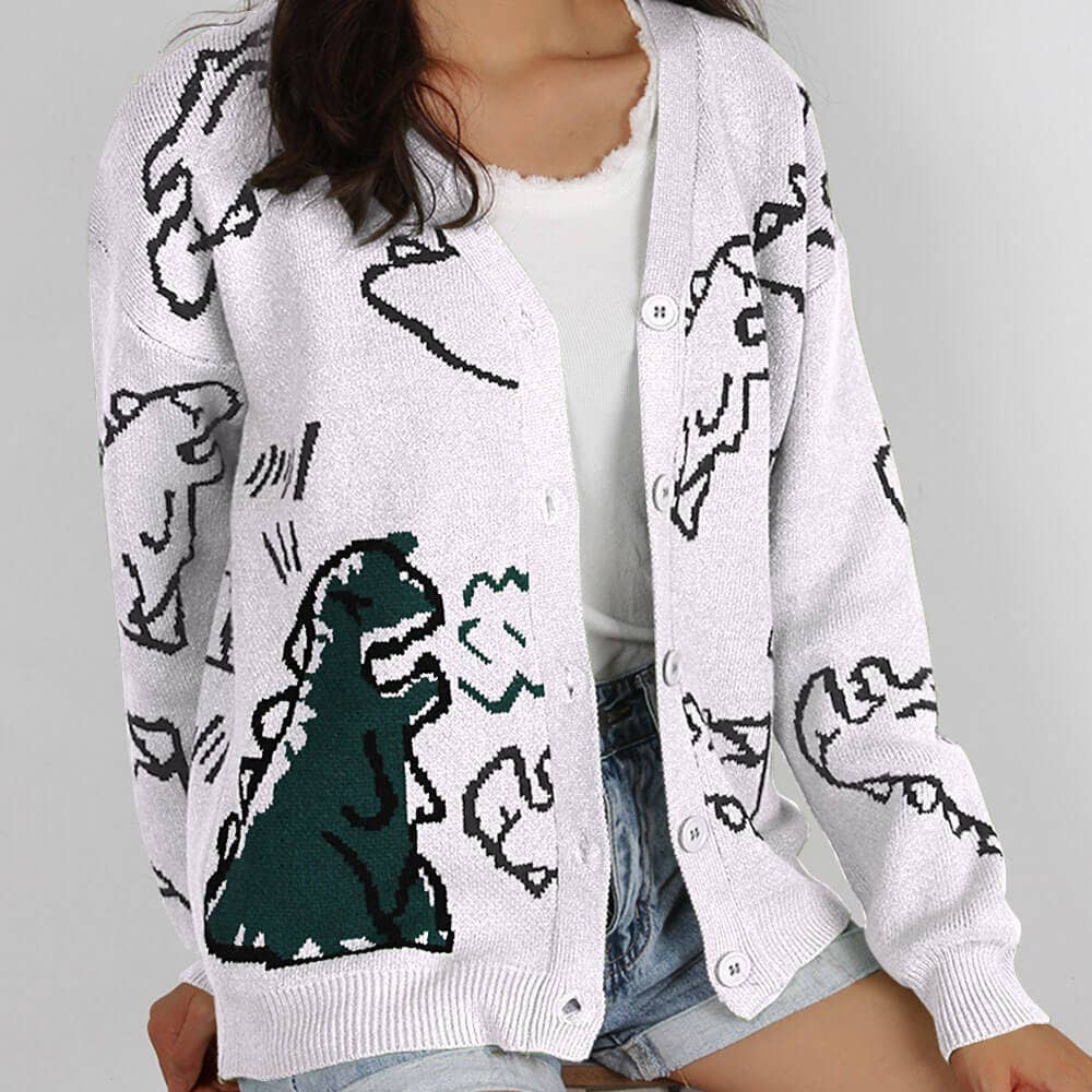 THE JACKET IS A LOOSE CARTOON DINOSAUR CARDIGAN