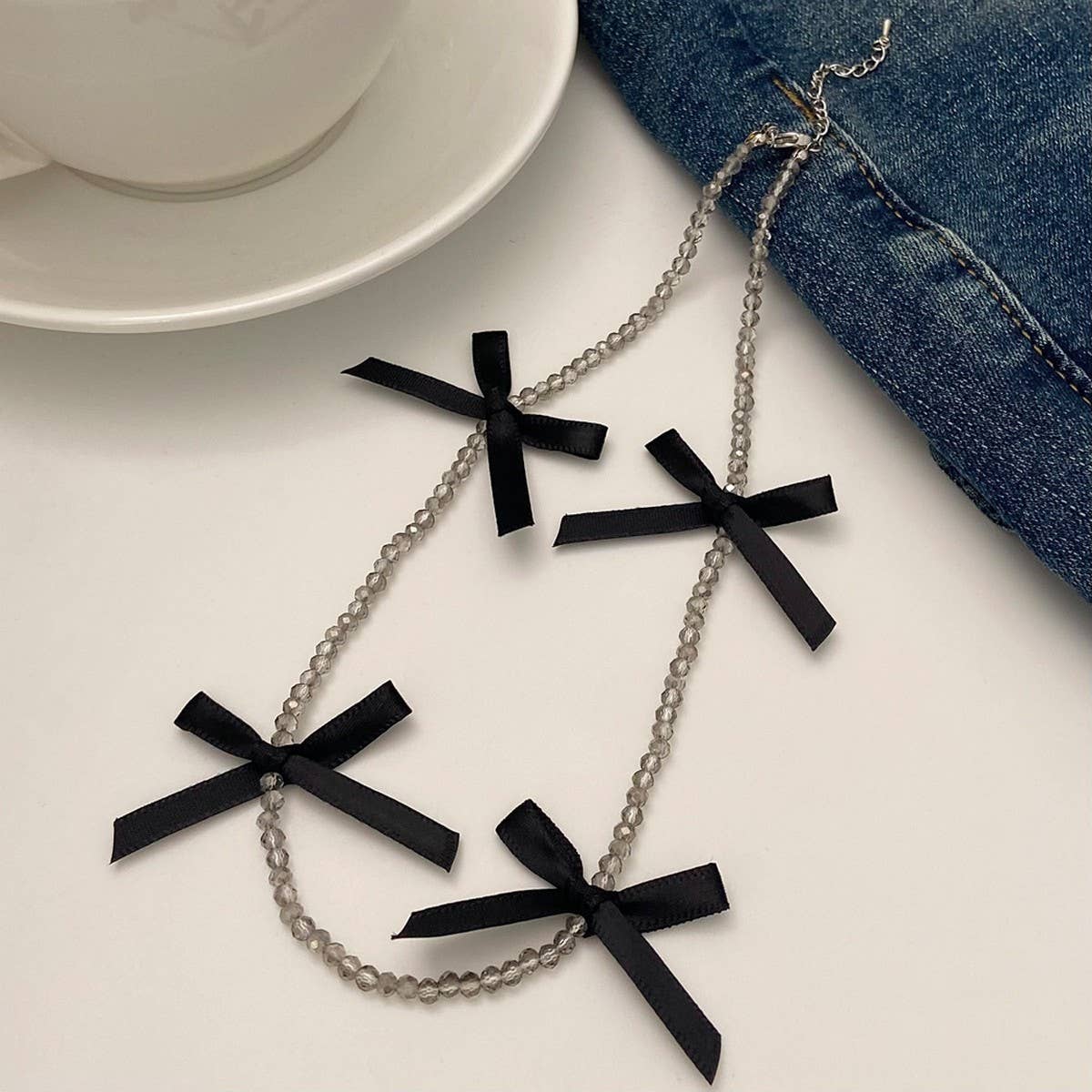 HAND-WOVEN BLACK CRYSTAL BEADED BOW NECKLACE