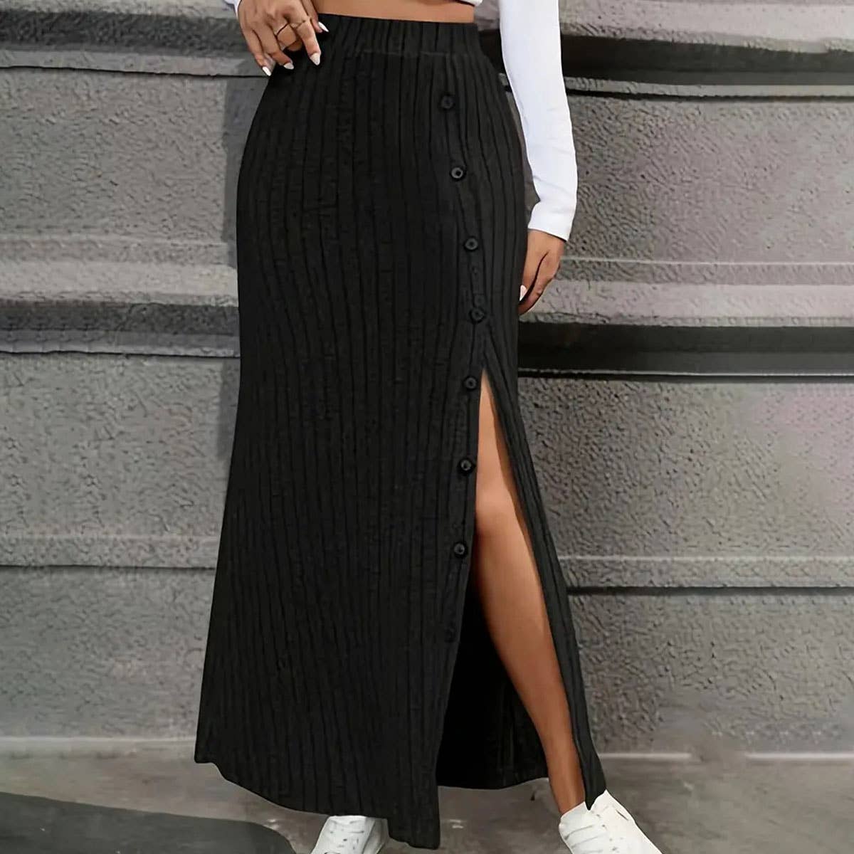 SLIT SLIT BUTTONS ADORN A DRAPED HIP SKIRT