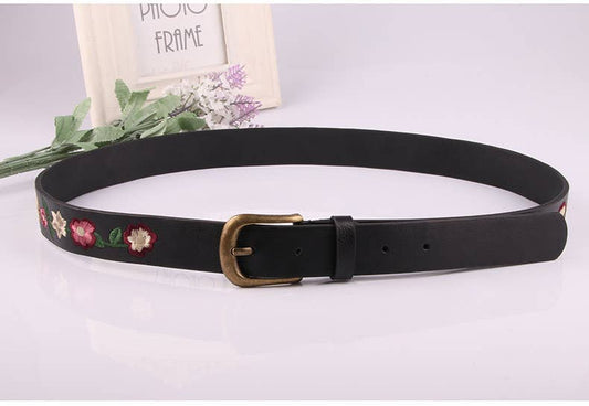 Embroidered flowers decorate a vintage belt