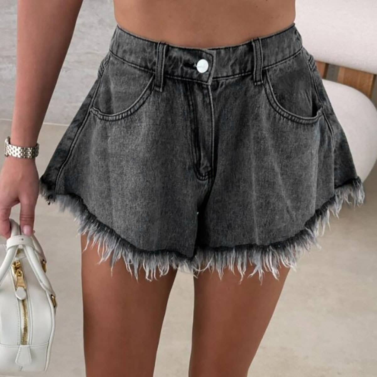 High-waisted umbrelle-shaped black denim shorts