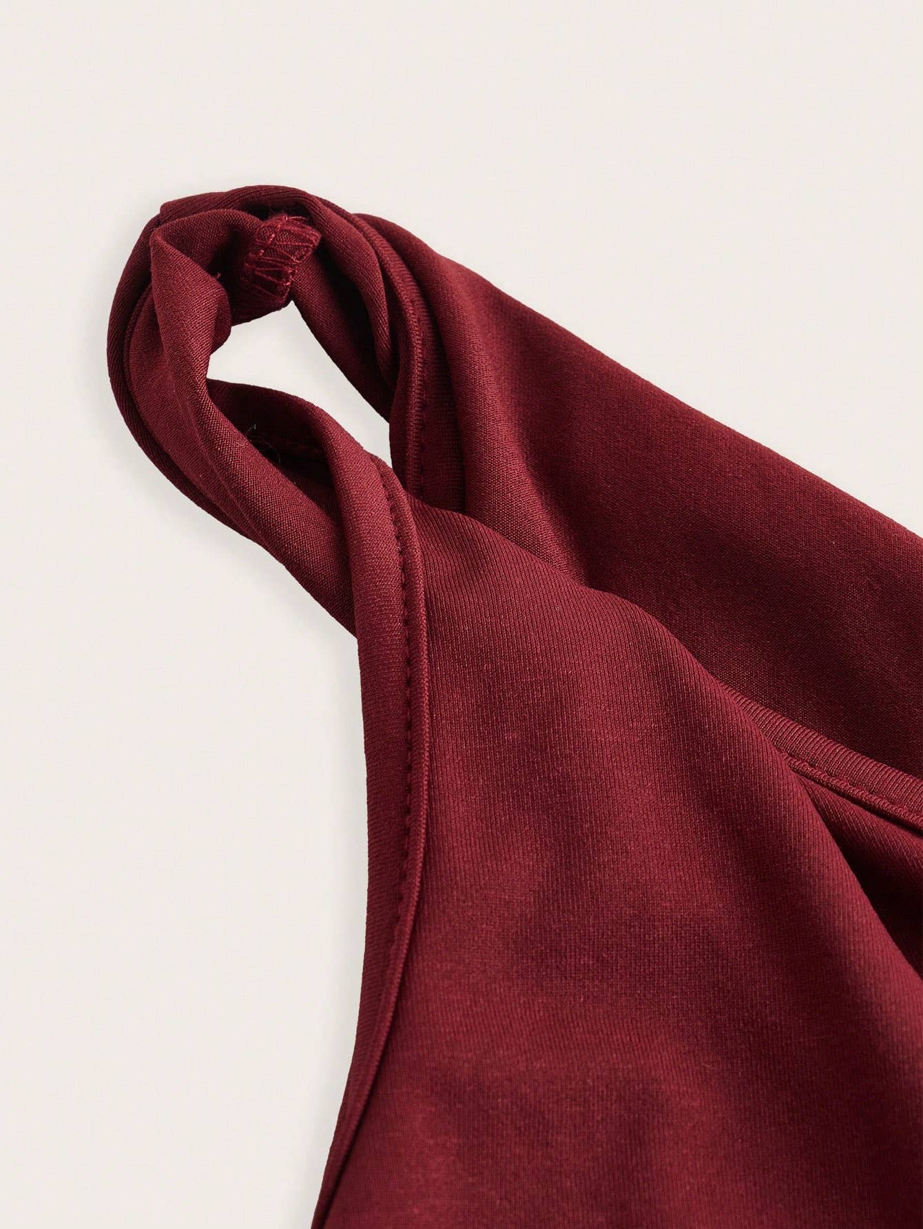 Solid-color knotted single-shoulder hem vest