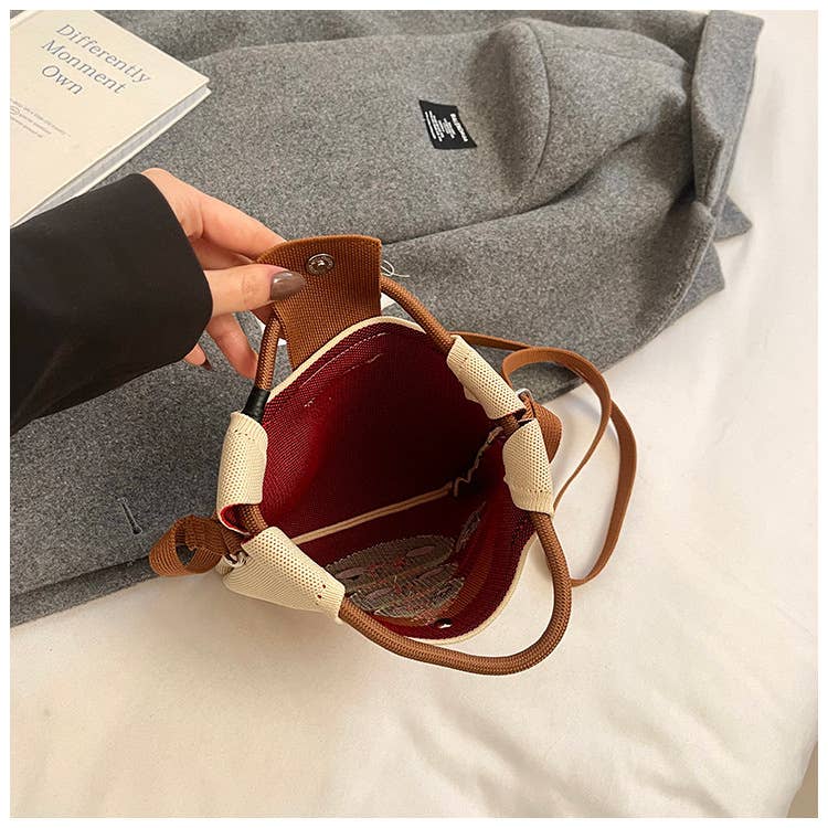 Lightweight and versatile hand-held crossbody bag