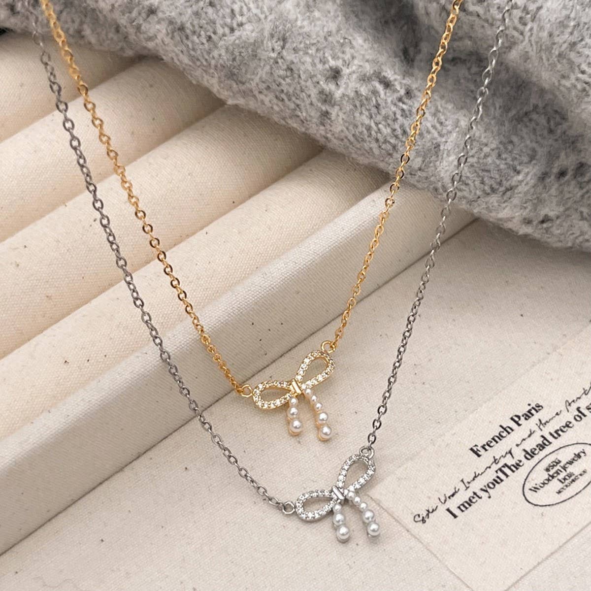 MICRO-PAVED ZIRCONIA PEARL BOW PENDANT NECKLACE