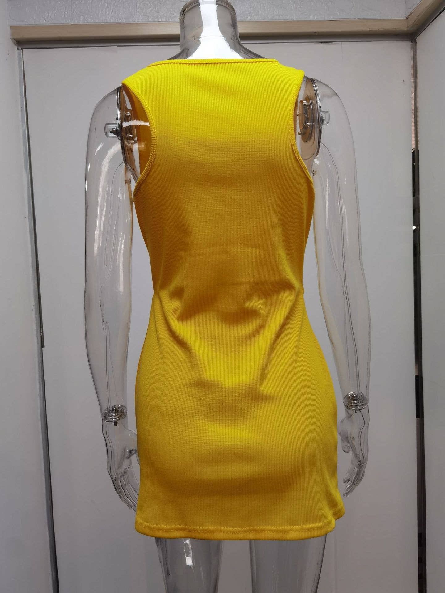 Tight-fitting dress with lace-up pleats