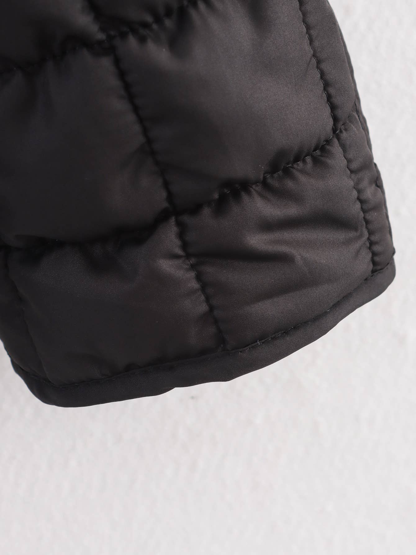 Short textured quilted three-dimensional coat