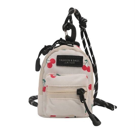 Printed mini lipstick headphones and small bag