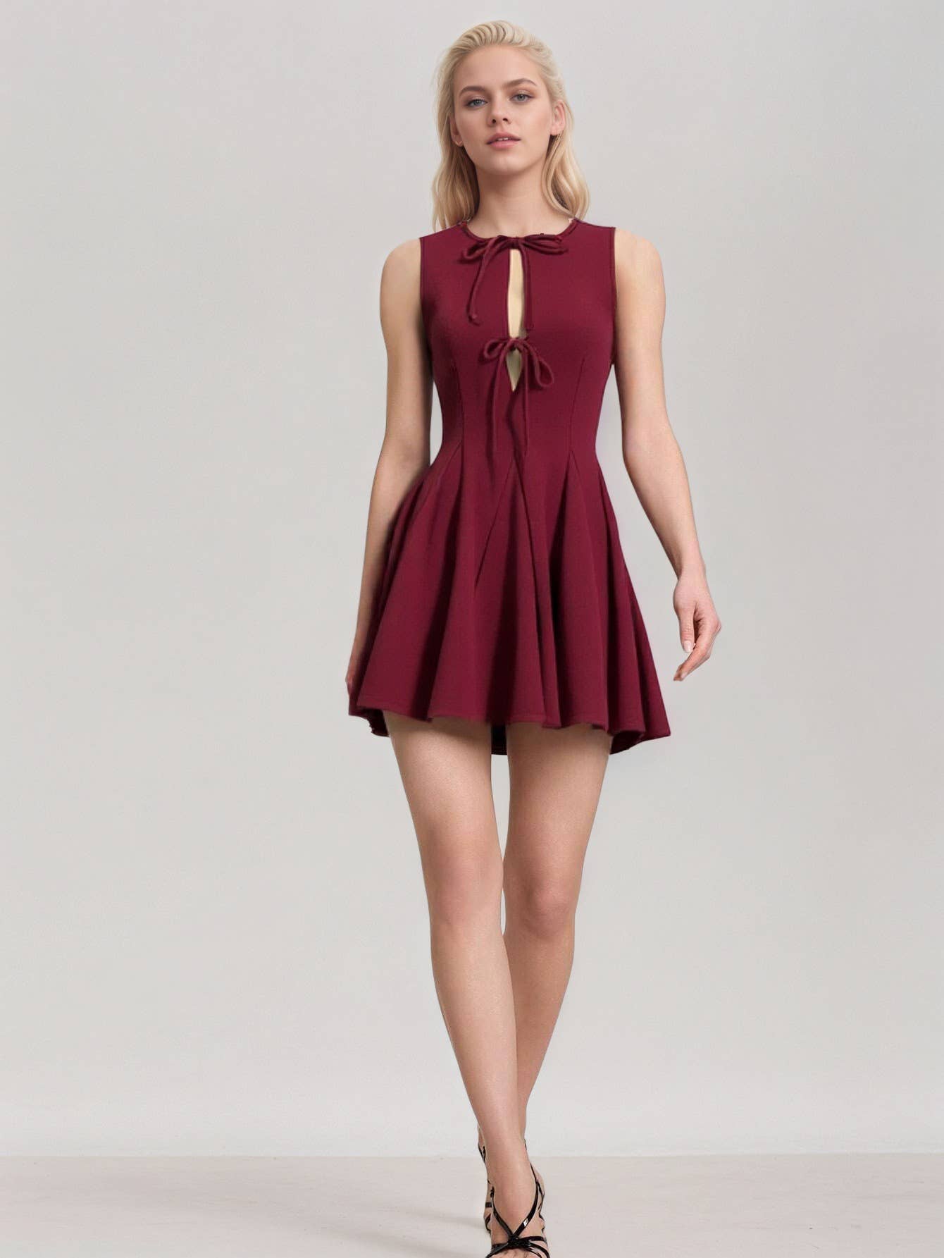Fitted waist and bow tie sleeveless dress
