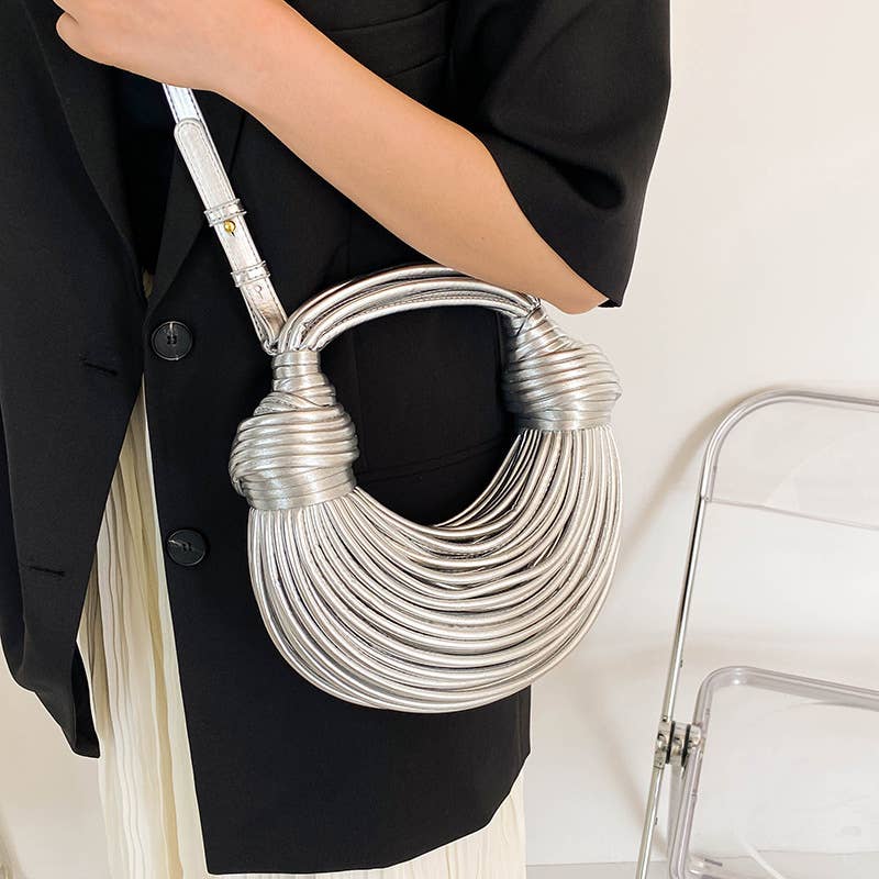 Metallic color striped appearance glossy handbag