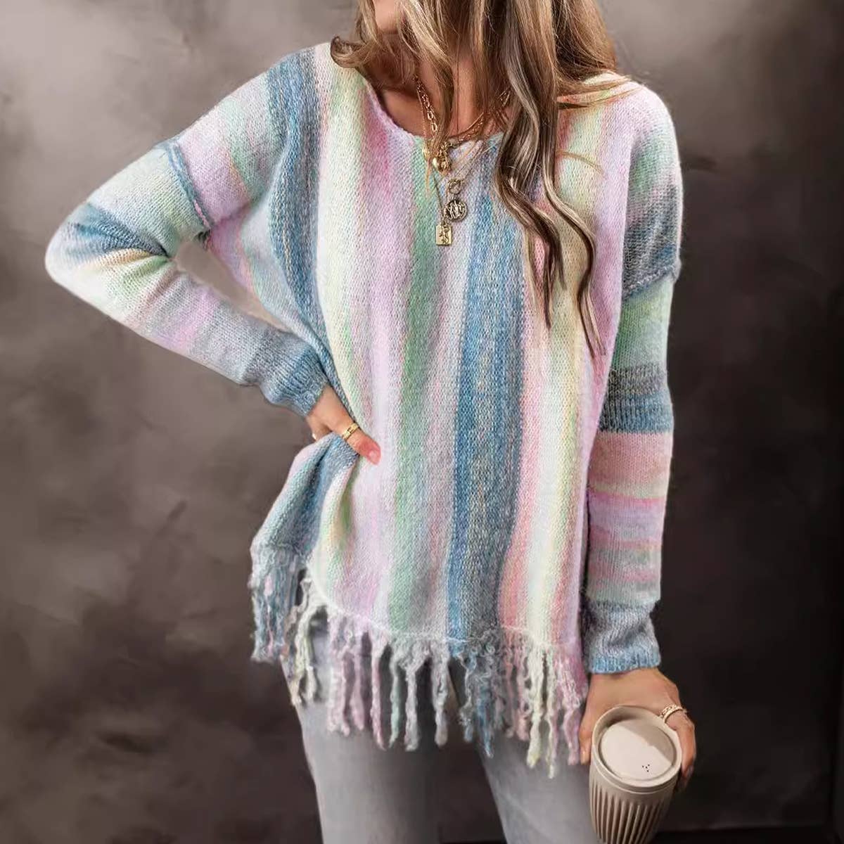 Stylish lady with fringe patchwork sweater