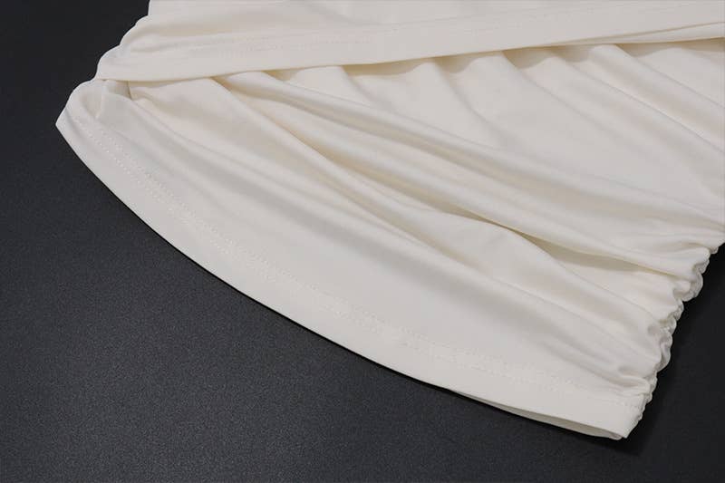 Irregular short crop top with a slanted collar