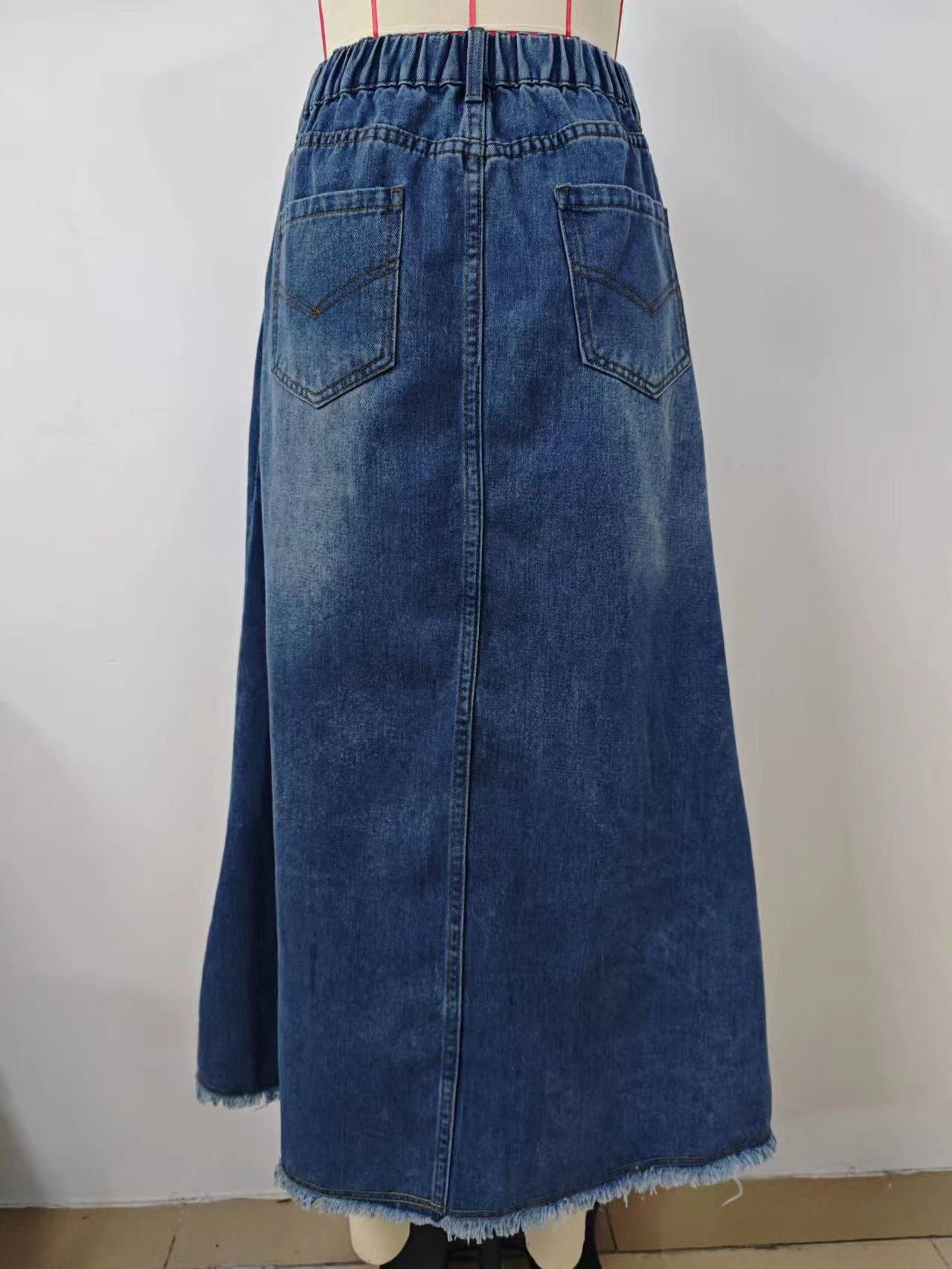 WASHED DENIM SKIRT WITH RAW HEM MIDI