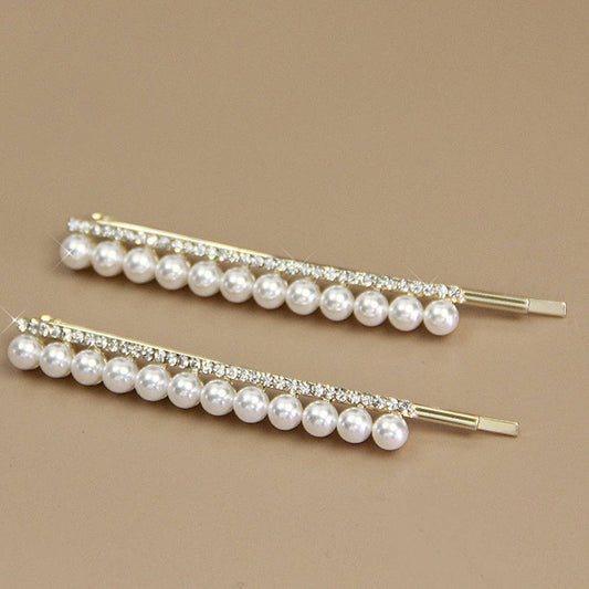 A PAIR OF ELEGANT PEARL AND RHINESTONE HAIR PIN_CWAHA1232