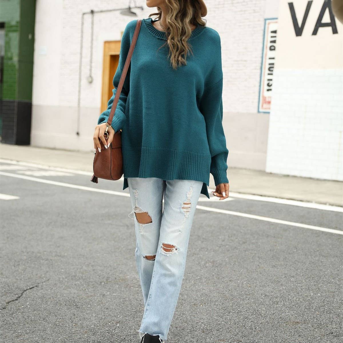 Short front and long irregular crew-neck sweater