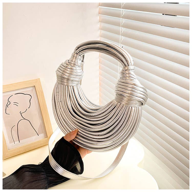 Metallic color striped appearance glossy handbag