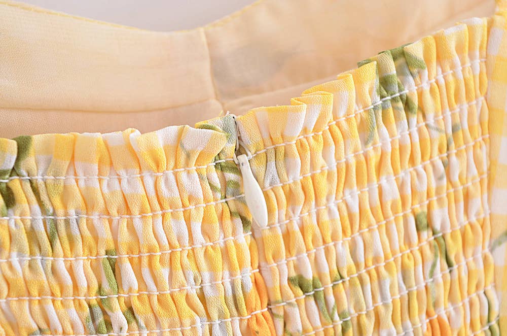 A strappy dress with floral prints and ruffles