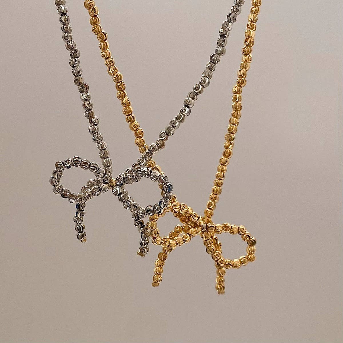 WEAR A HIGH-END METAL ROUND BEAD BOW NECKLACE