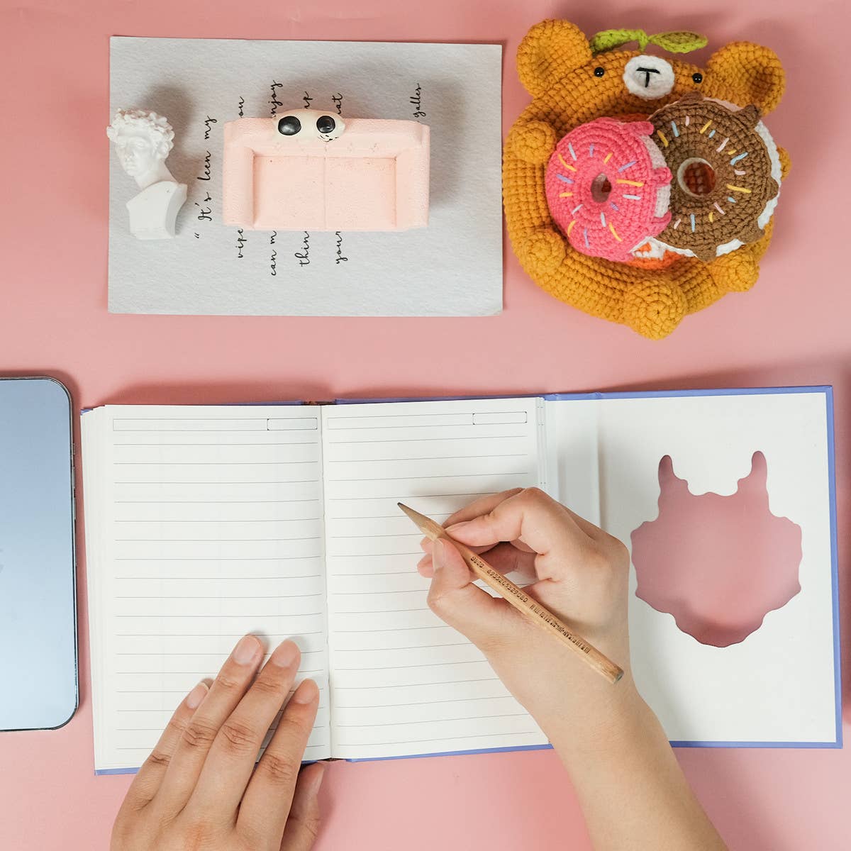 COLORFUL PORTABLE NOTEBOOK ON BLUE BACKGROUND