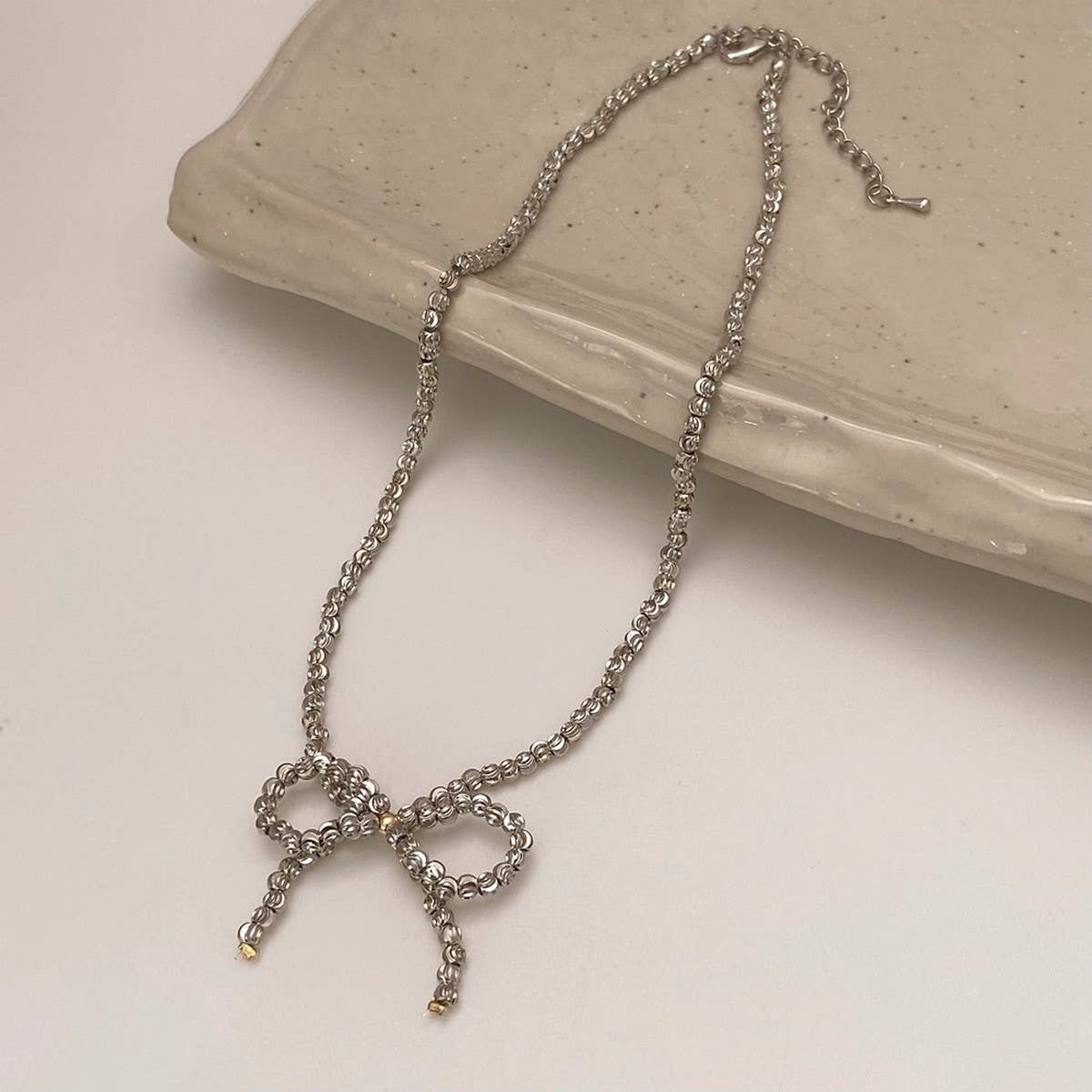 WEAR A HIGH-END METAL ROUND BEAD BOW NECKLACE