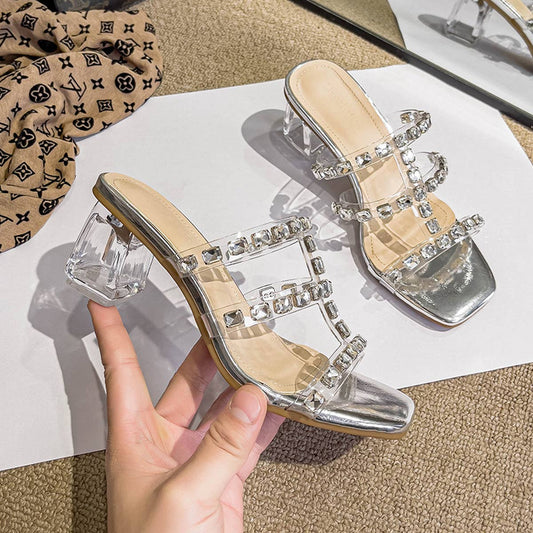 WEARING RHINESTONE STRAPPY HIGH HEELS