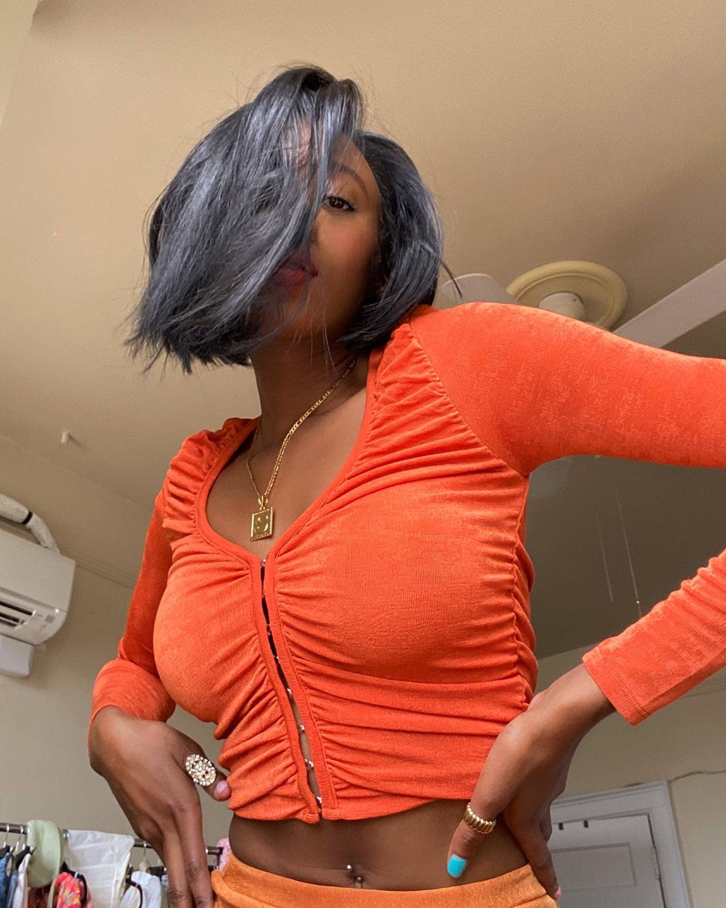 V-neck solid color pleated hidden button top