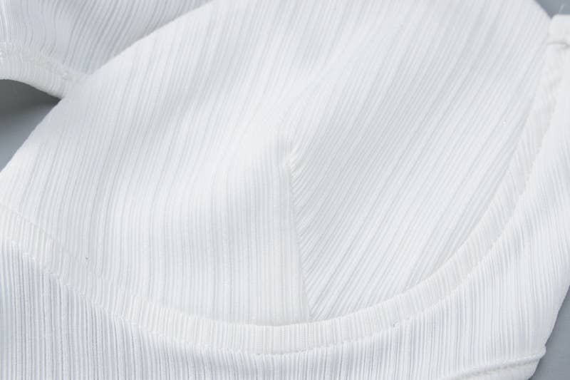 A backless cutout halter dress with a slim fit