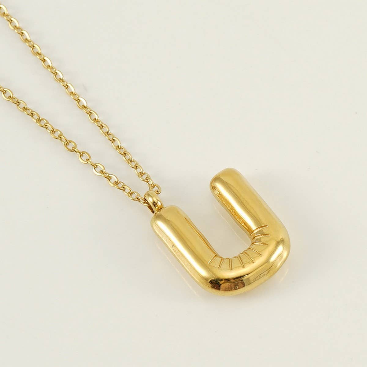 CWAJE1933_Stainless Steel Glossy Bubble Letter Necklace Gold