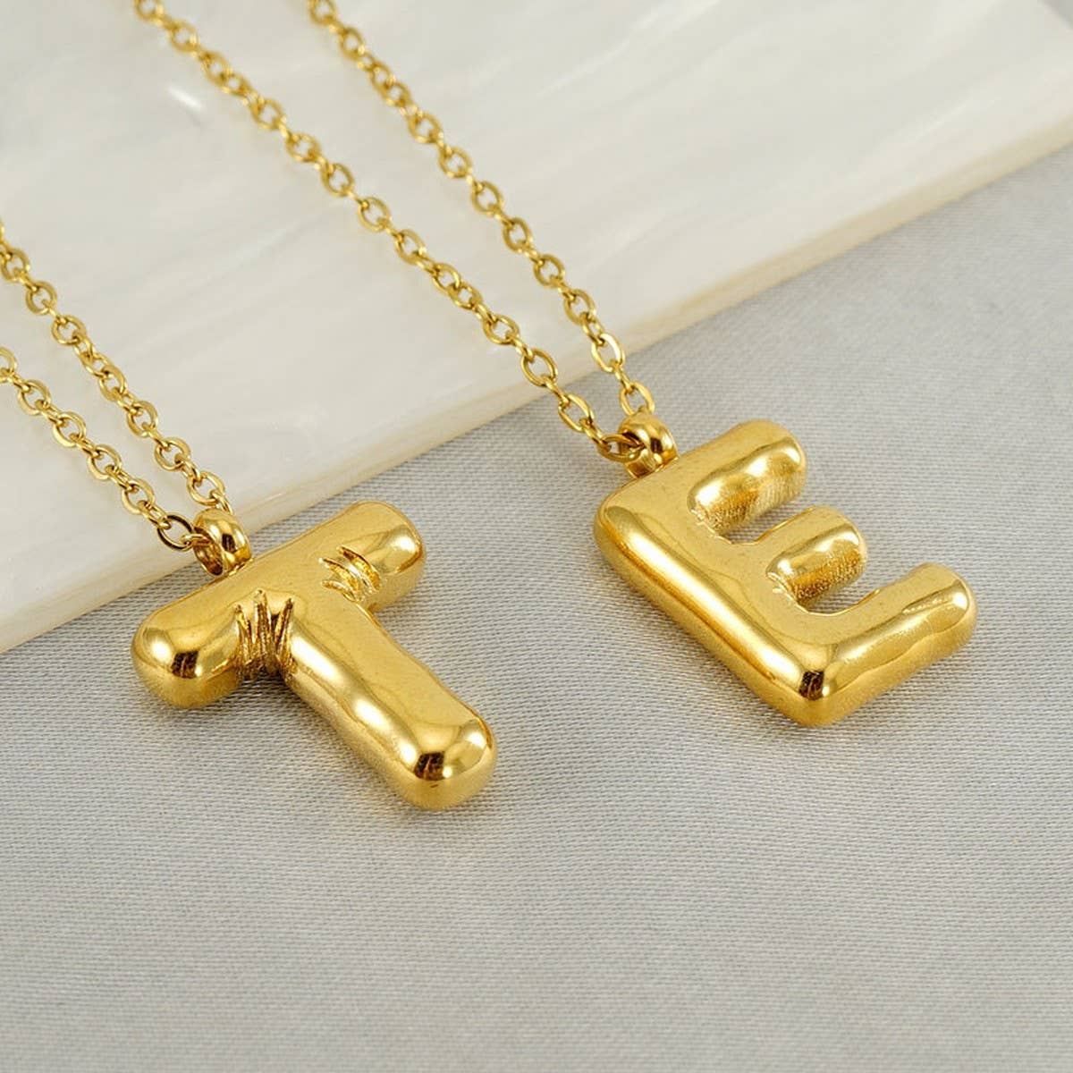 CWAJE1933_Stainless Steel Glossy Bubble Letter Necklace Gold