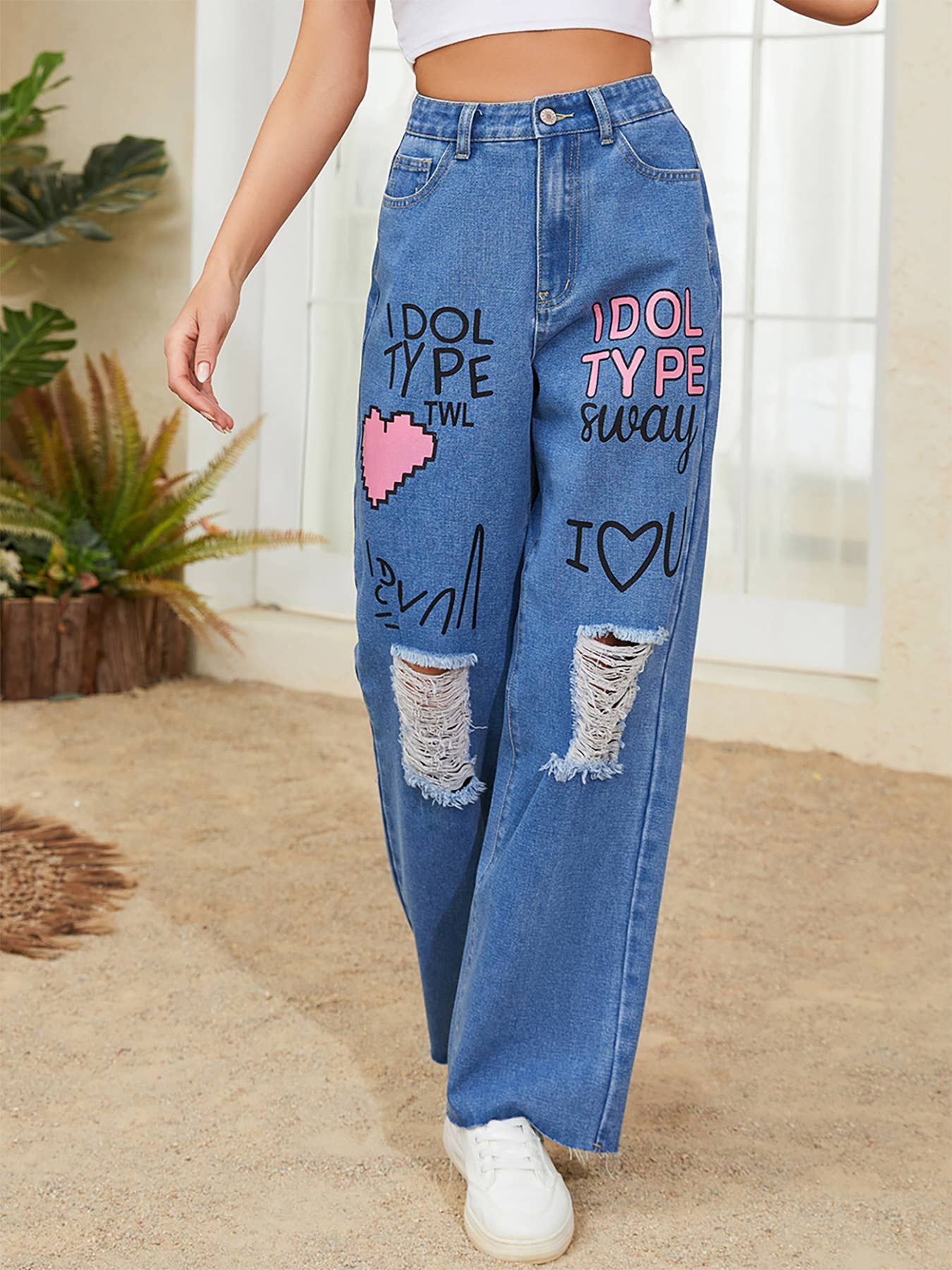 Graffiti printed loose,ripped denim trousers