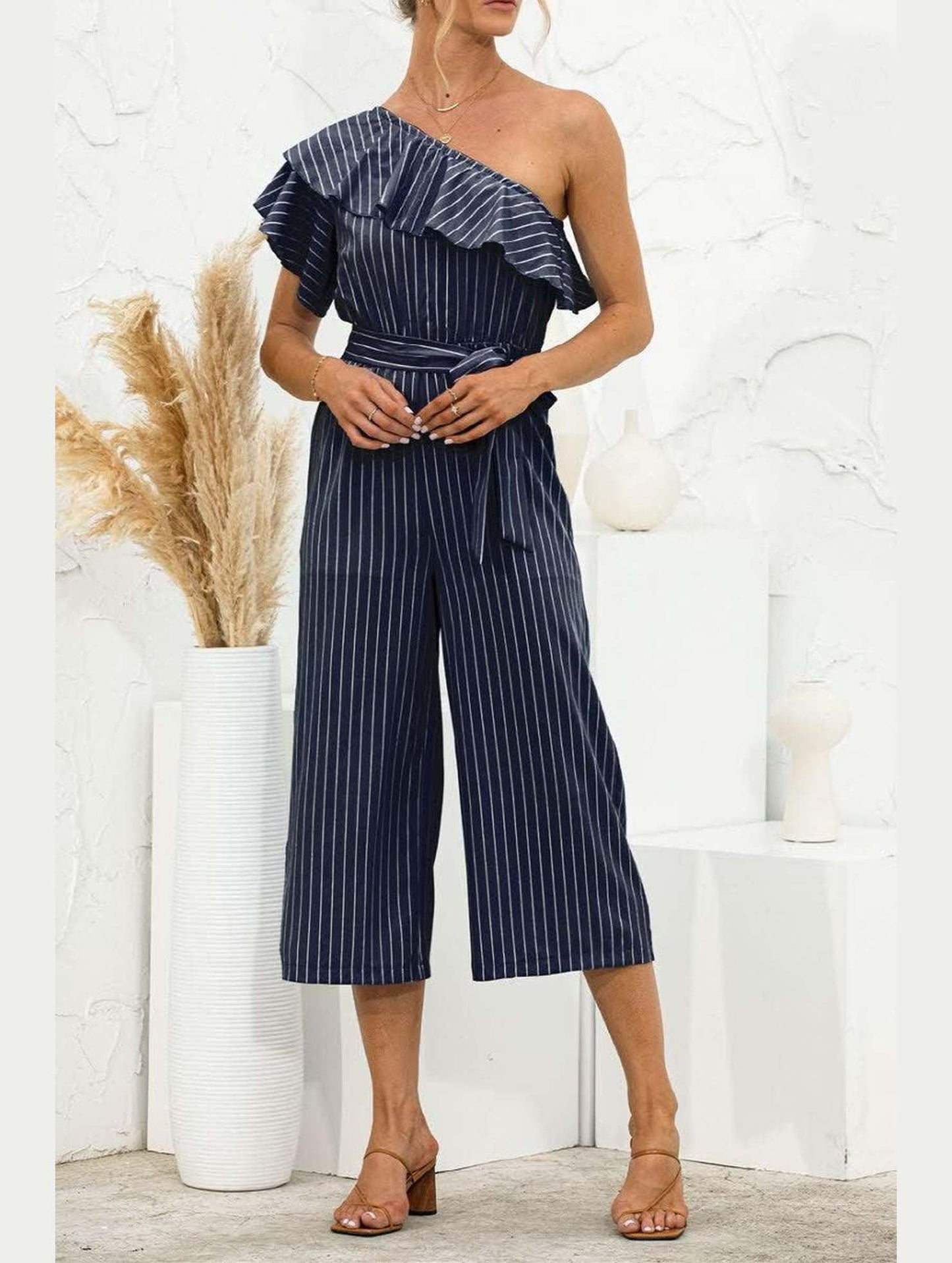 SLANTED SHOULDER RUFFLED STRIPED JUMPSUIT - Doublju