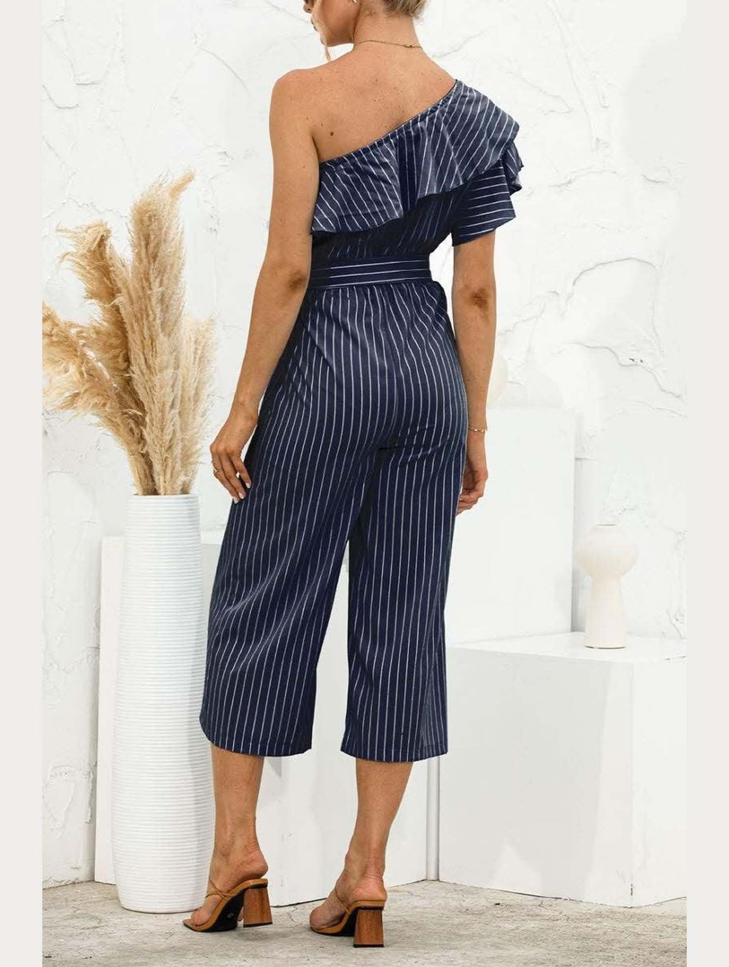 SLANTED SHOULDER RUFFLED STRIPED JUMPSUIT - Doublju