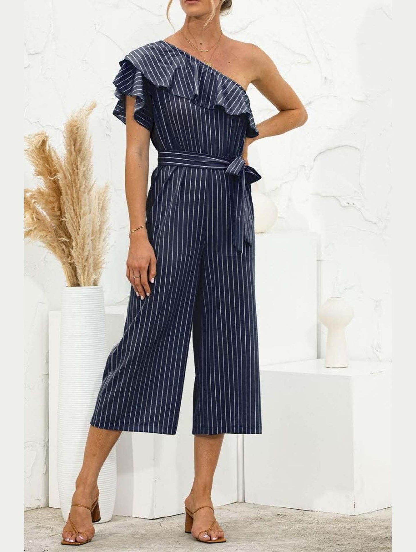 SLANTED SHOULDER RUFFLED STRIPED JUMPSUIT - Doublju