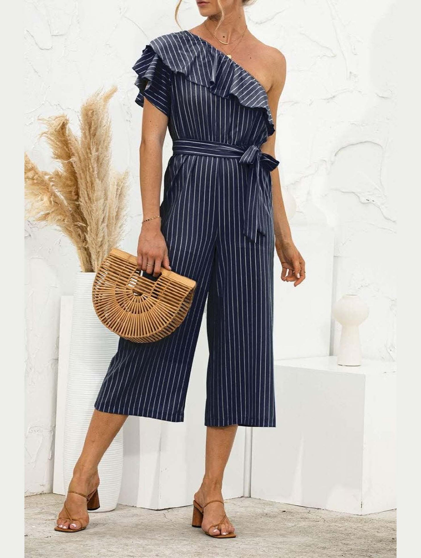 SLANTED SHOULDER RUFFLED STRIPED JUMPSUIT - Doublju
