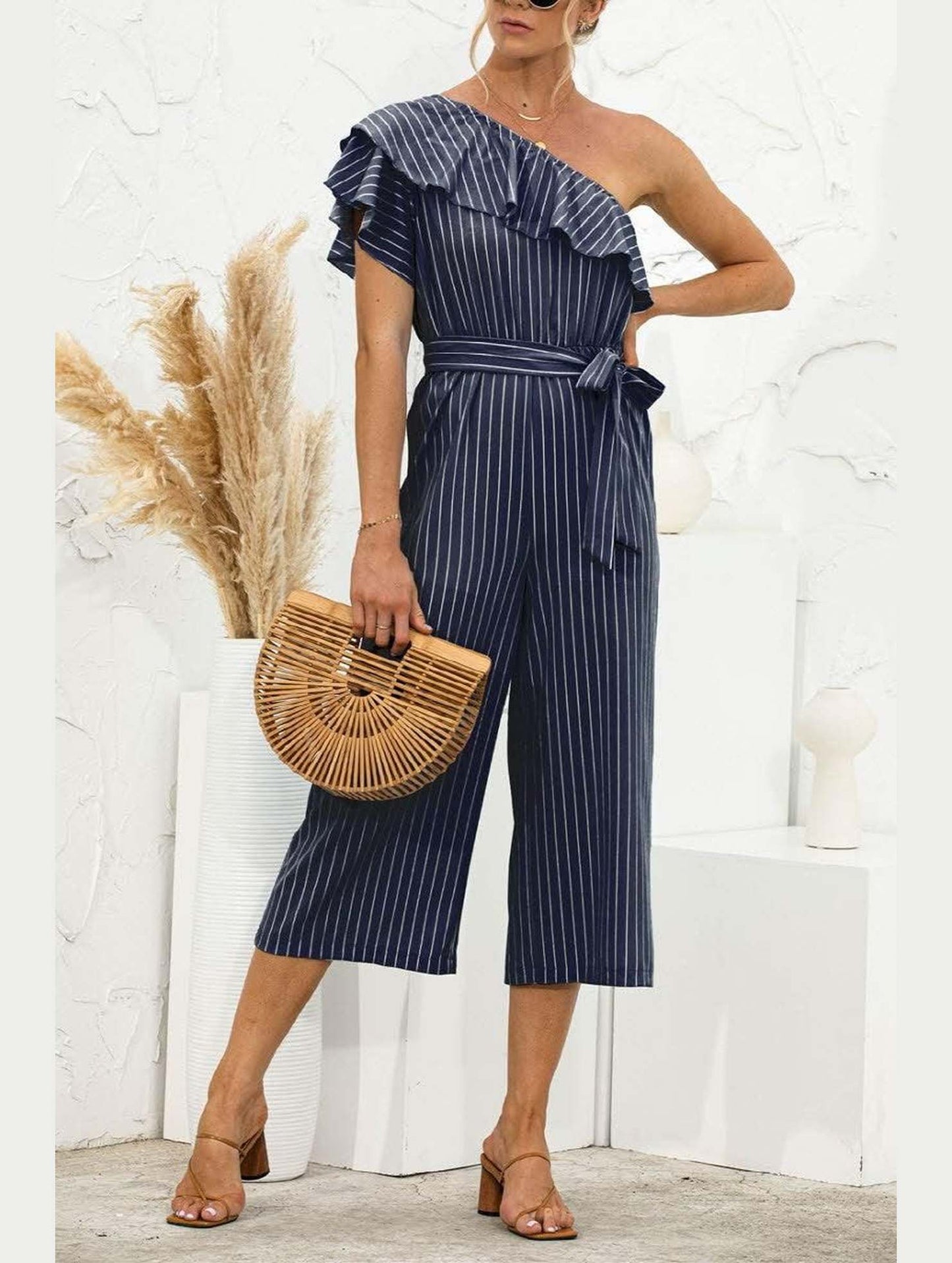 SLANTED SHOULDER RUFFLED STRIPED JUMPSUIT - Doublju