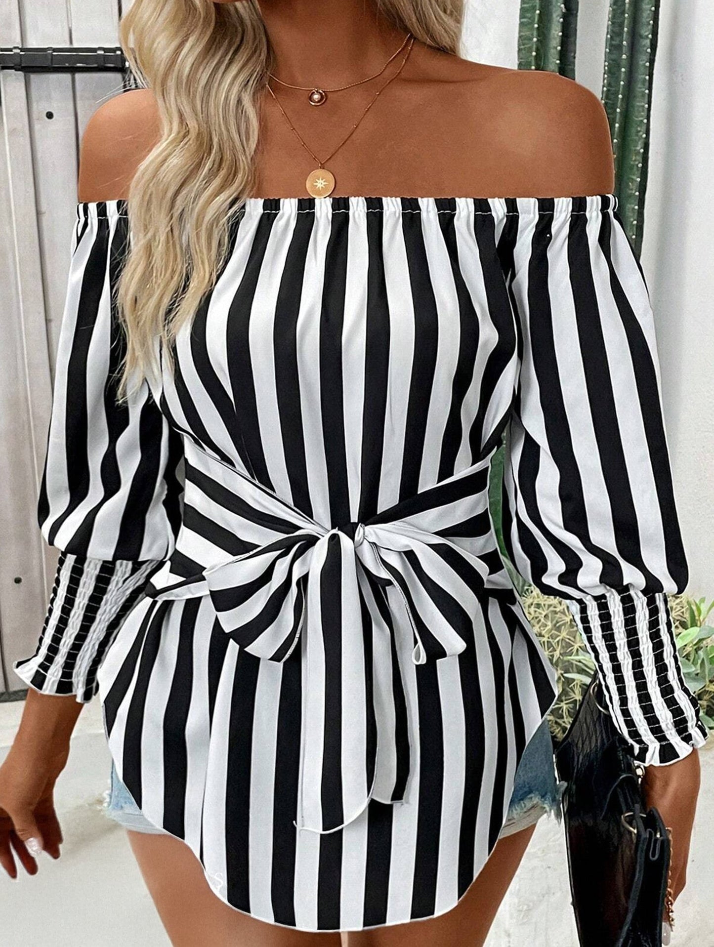 Loose off-the-shoulder asymmetrical striped shirt