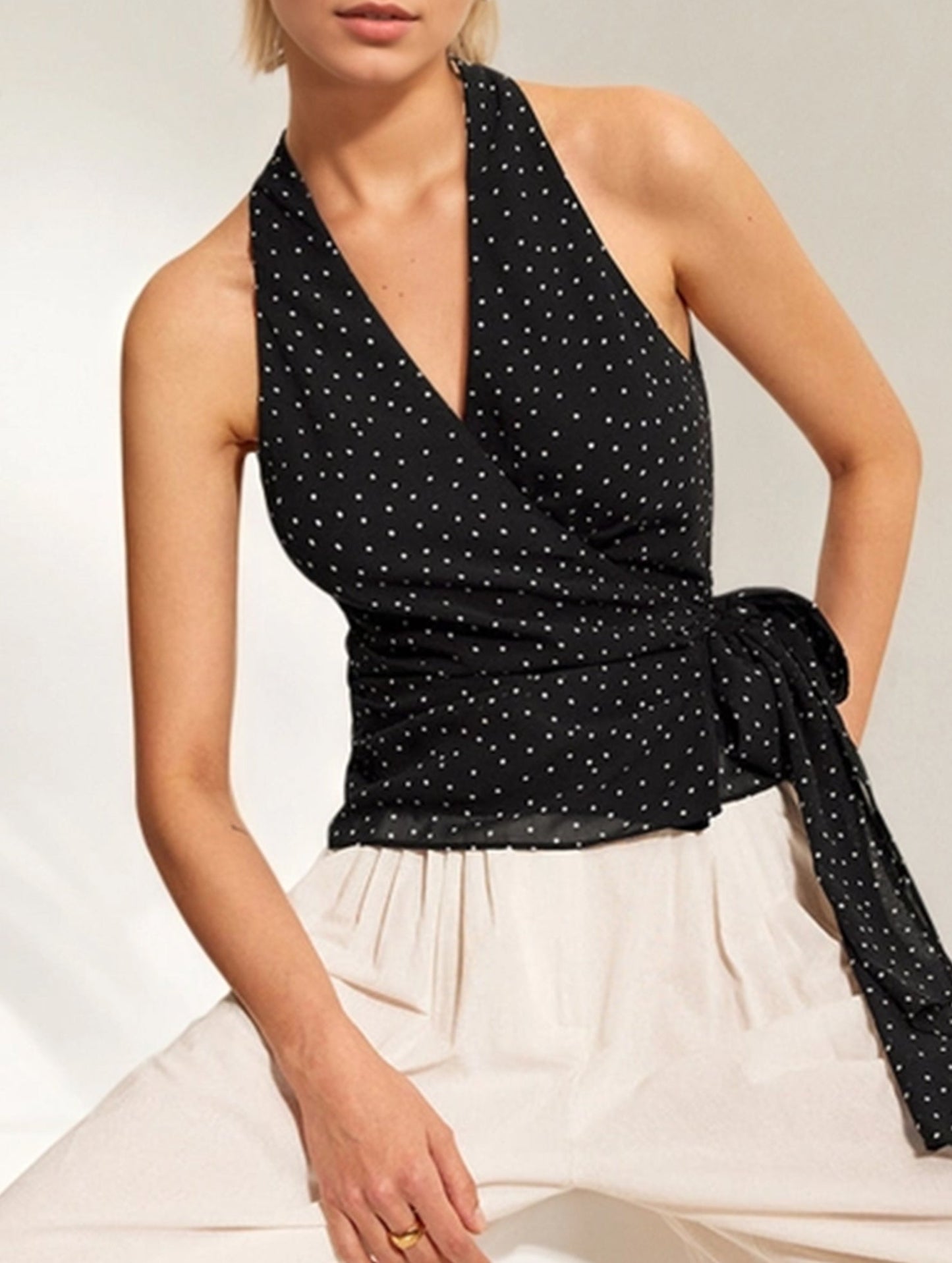 Polka dot sleeveless, cinched waist strap top