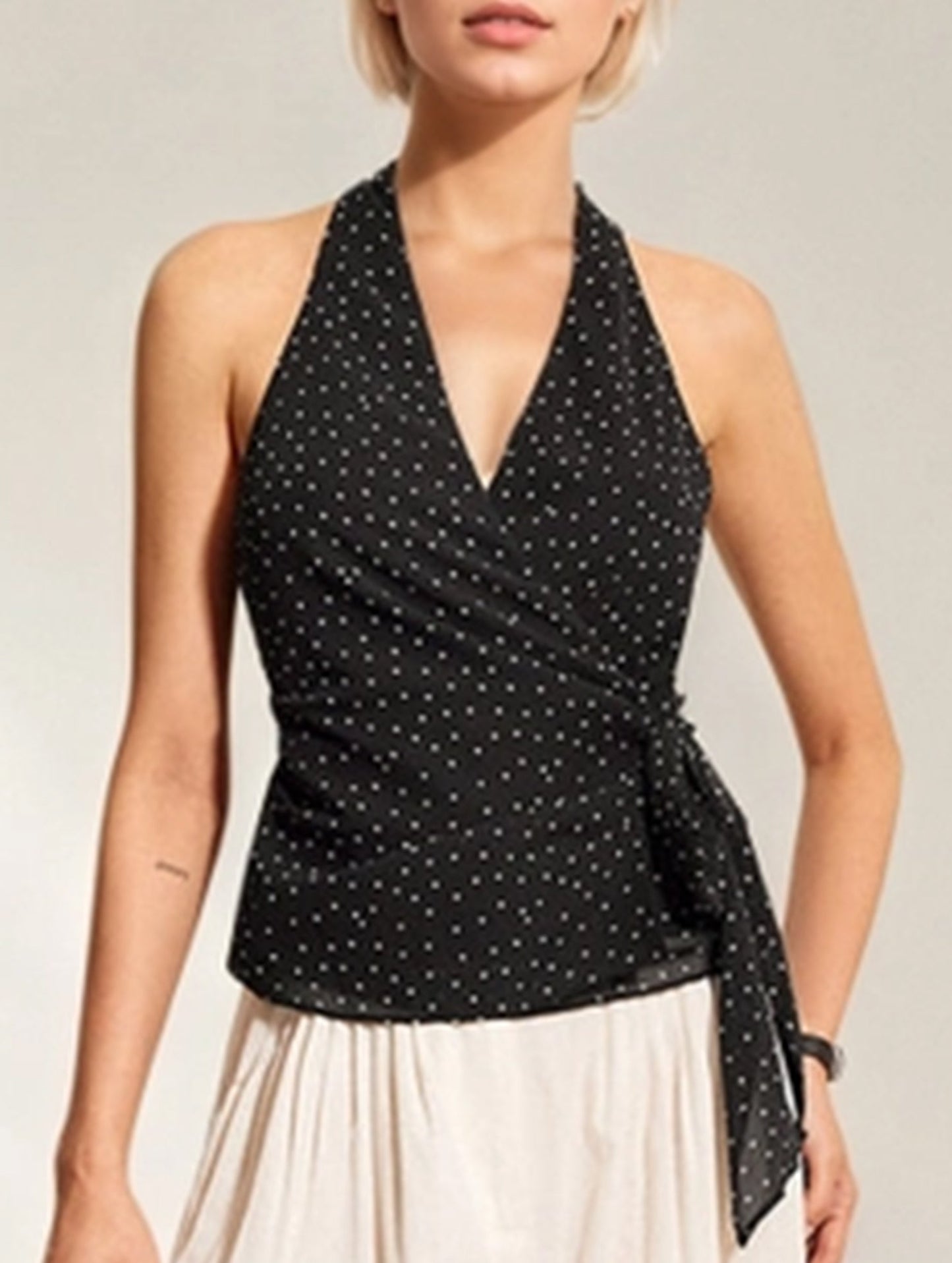 Polka dot sleeveless, cinched waist strap top