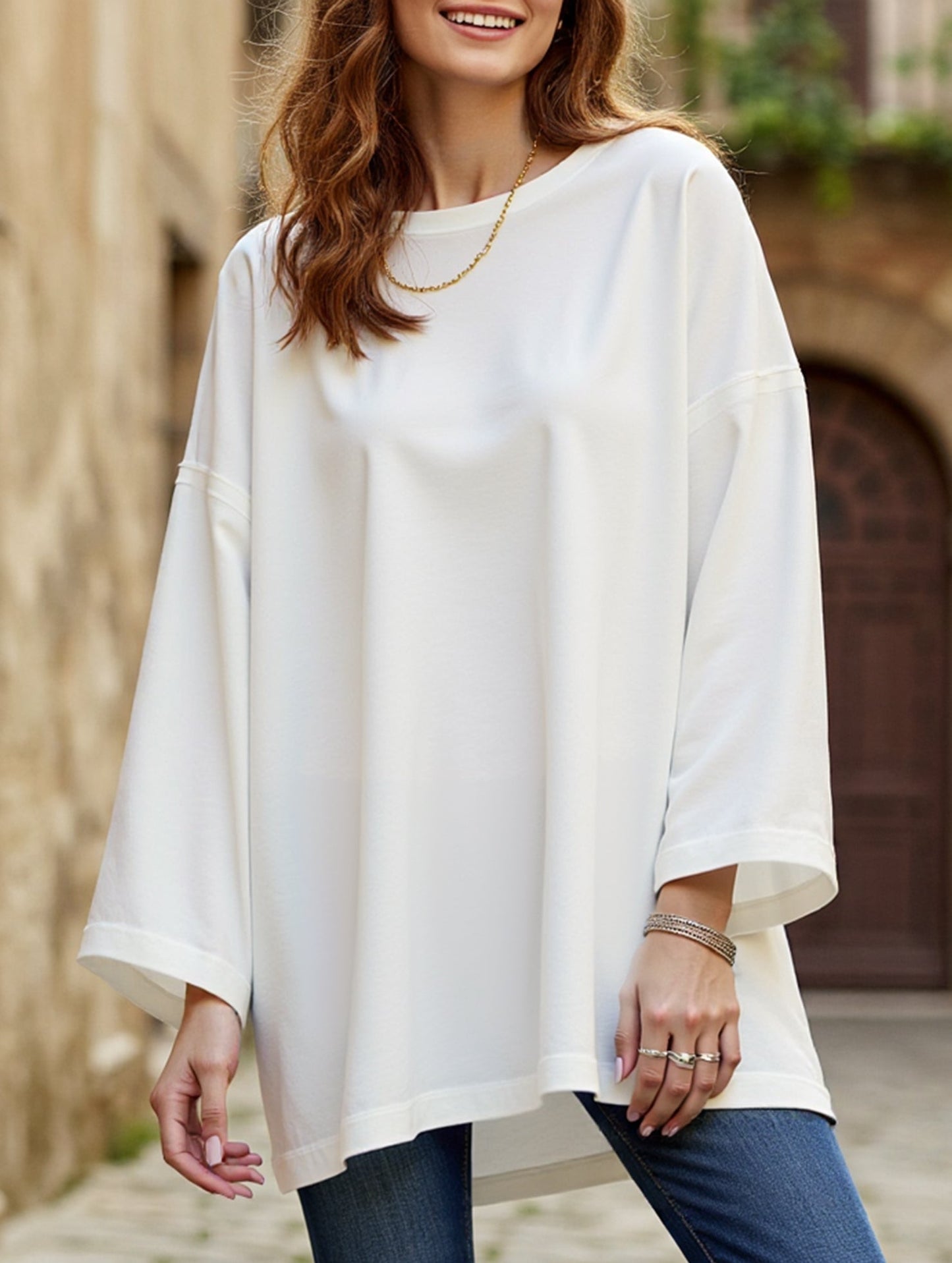 Solid color round neck slit long sleeve loose top