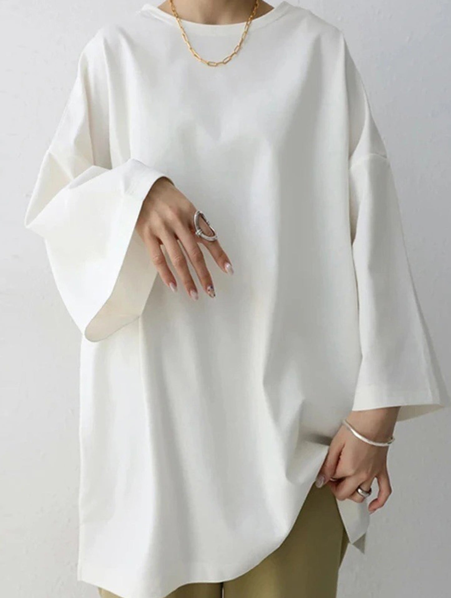 Solid color round neck slit long sleeve loose top