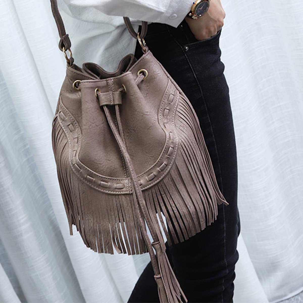WOMEN LEATHER TASSEL BUCKET BAG_CWAB0791
