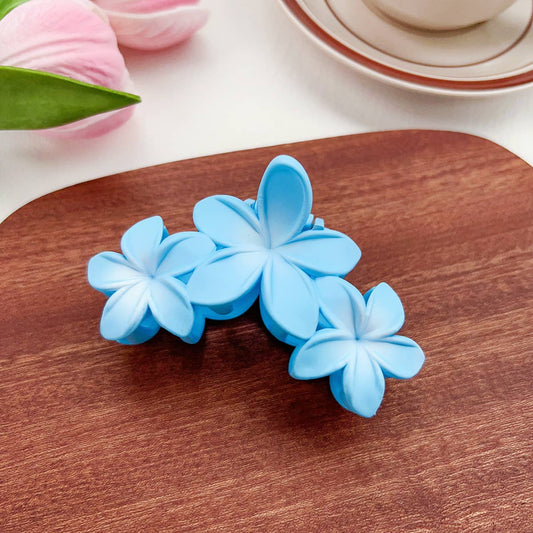 Candy-colored plastic hair clips with flowers