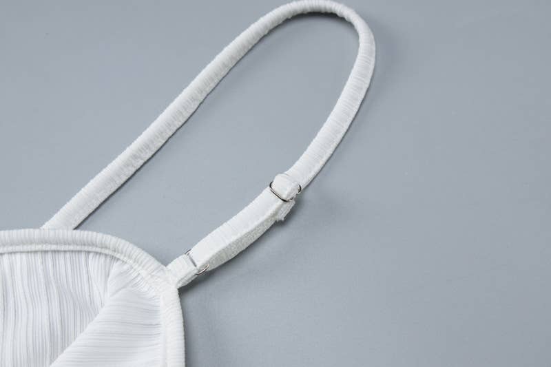 A backless cutout halter dress with a slim fit