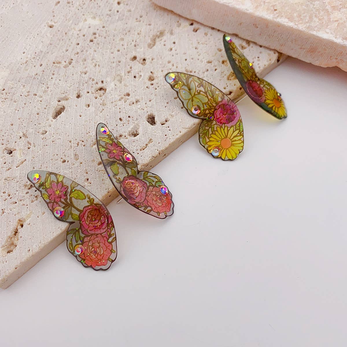 Painted ear studs with simulated butterfly wings