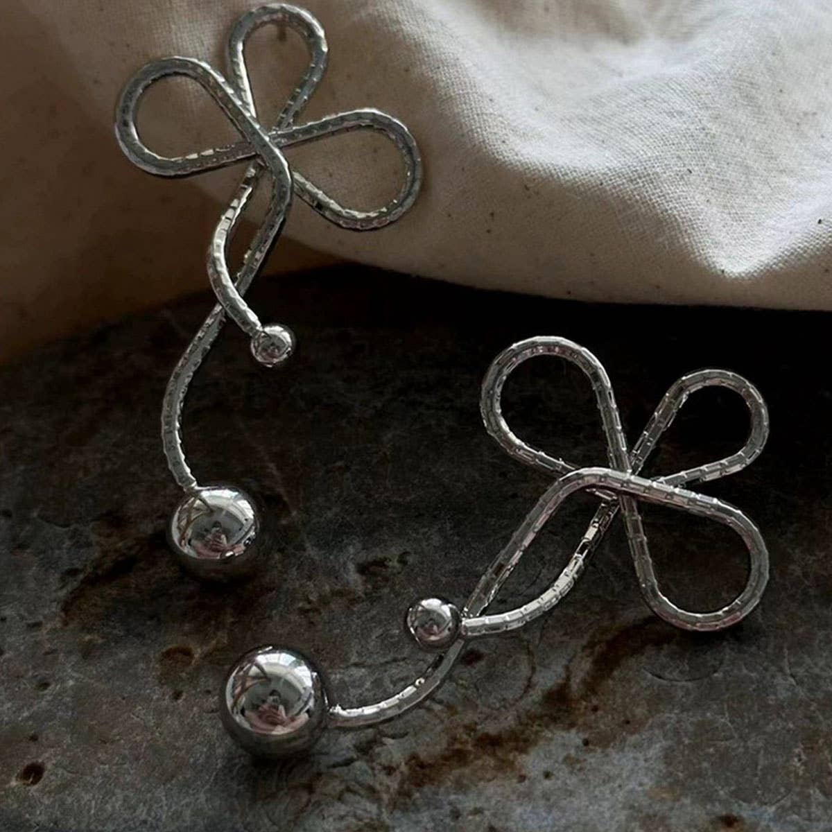 GEOMETRIC TWISTED FLOWER PEARL TASSEL BOW EARRINGS