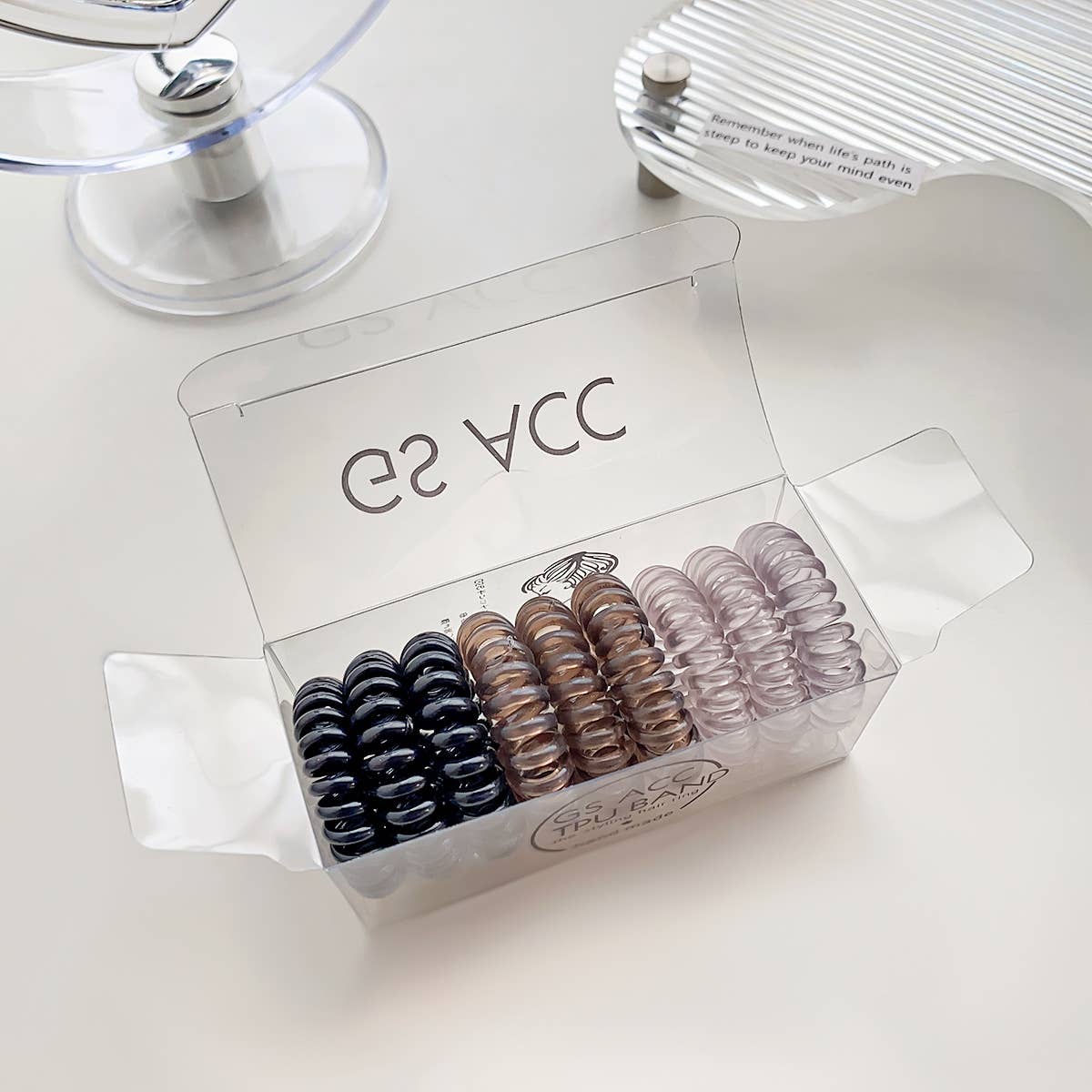 Nine candy-colored rubber bands for hair ties