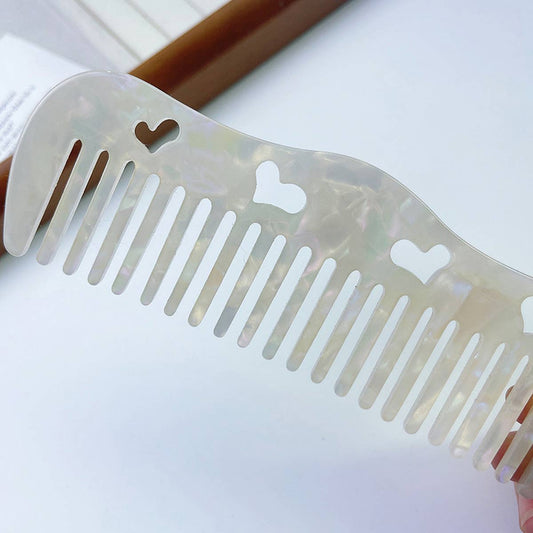 HOLLOW HEART PORTABLE MASSAGE COMB
