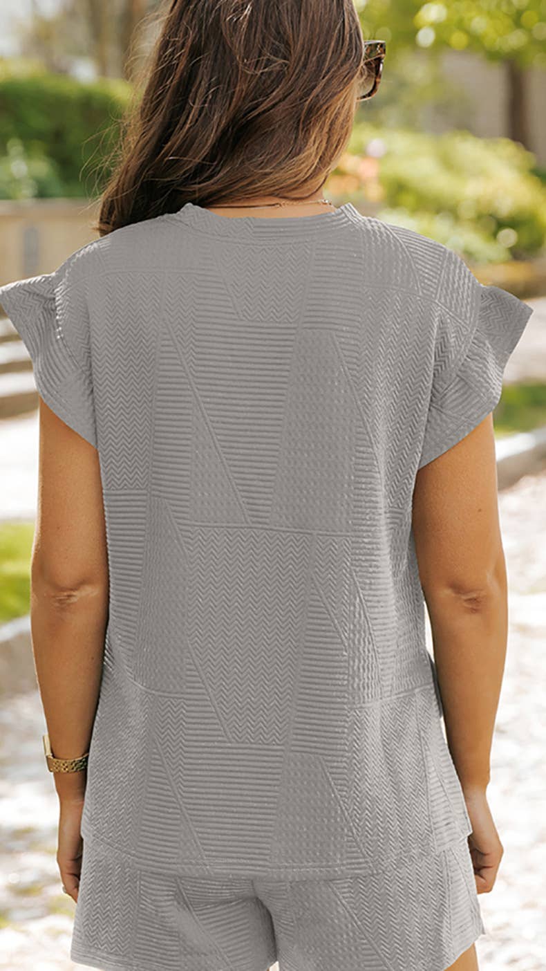 Stylish ruffled sleeveless top and shorts suit