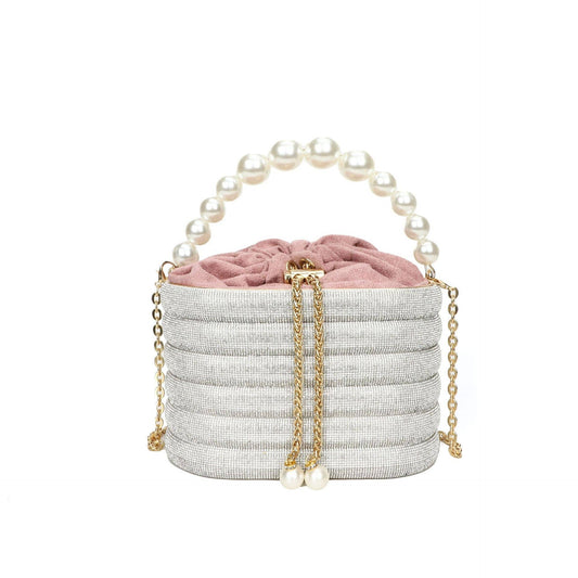 Slung over a pearl sparkling handbag