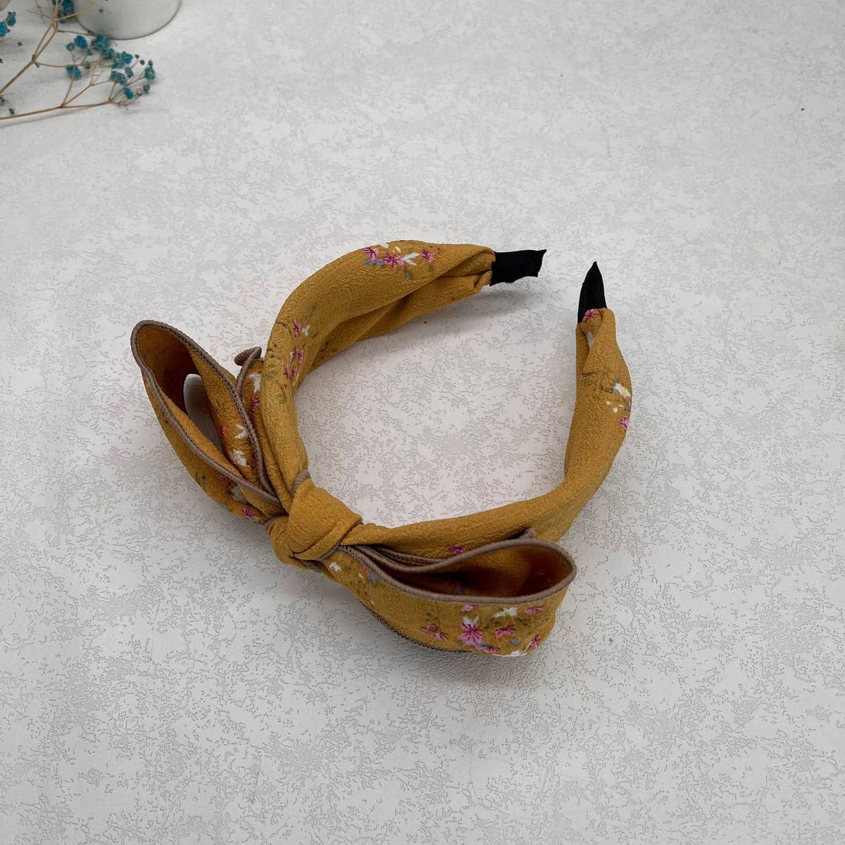 WIDE-BRIMMED FLORAL BOW HEADBAND